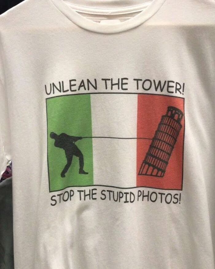 Funny shirt with a cartoon of someone pulling the Leaning Tower of Pisa upright.