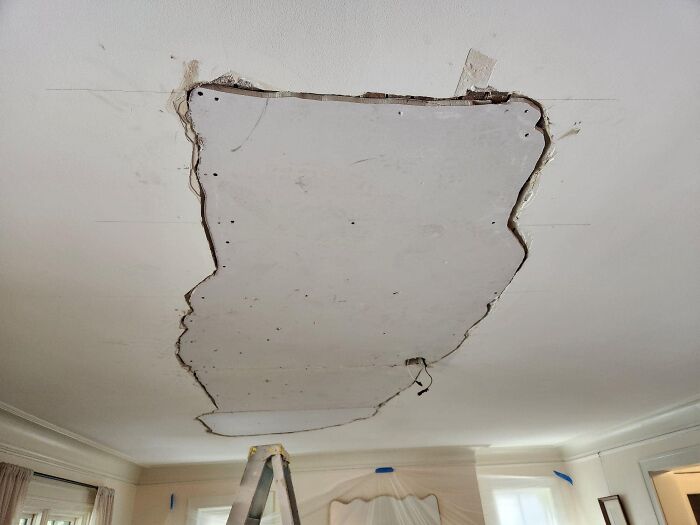 Ceiling showing a poorly patched hole, illustrating a funny construction fail.