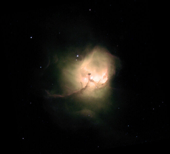 Colorful nebula glowing in the dark universe, showcasing interstellar clouds and star formations.