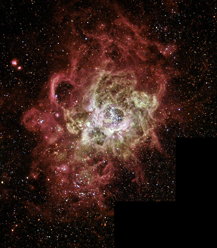 Stunning cosmic view featuring vibrant nebula clouds and twinkling stars in space.