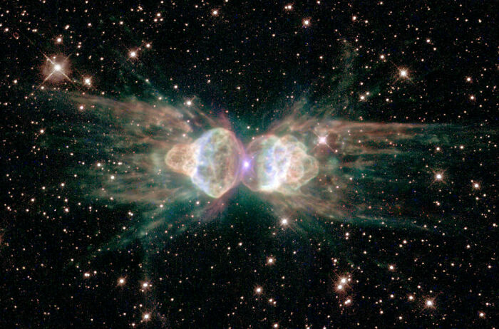 Spectacular nebula displaying vibrant colors against a starry backdrop.