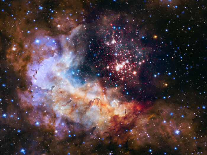 Colorful nebula with vibrant gas clouds and star clusters, showcasing the beauty of space.