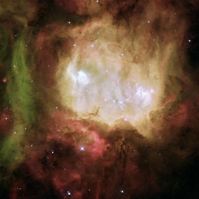 Colorful celestial nebula with glowing gases and stars, showcasing the beauty of space.