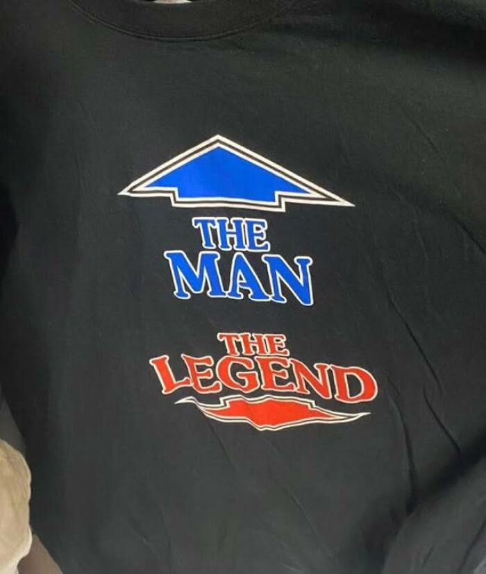 Weird shirt pointing to "The Man, The Legend" in blue and red text.