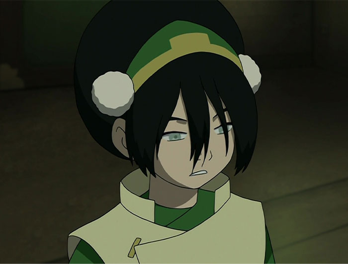 Anime character with dark hair and green attire, representing a strong female protagonist in a determined pose.