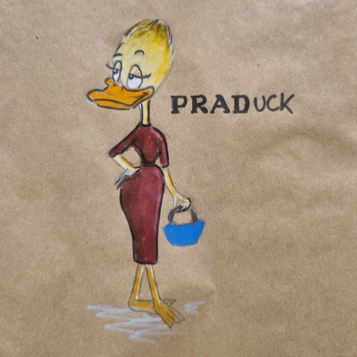 Cartoon of a duck in a dress labeled "PRADuck" on a lunch bag, featuring pun-filled humor illustration.