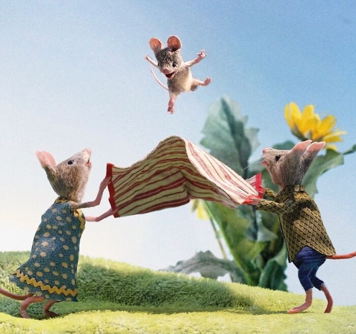 Miniature mice play with a striped blanket outdoors in Maggie Rudy's detailed Mouseland scene.