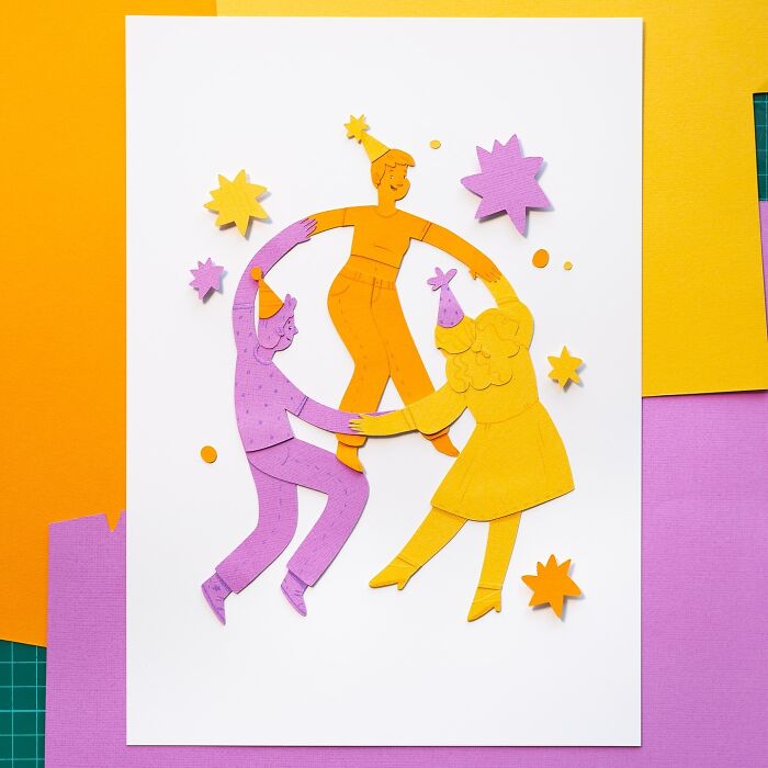 Layered paper art of three colorful characters dancing, with star shapes in the background.