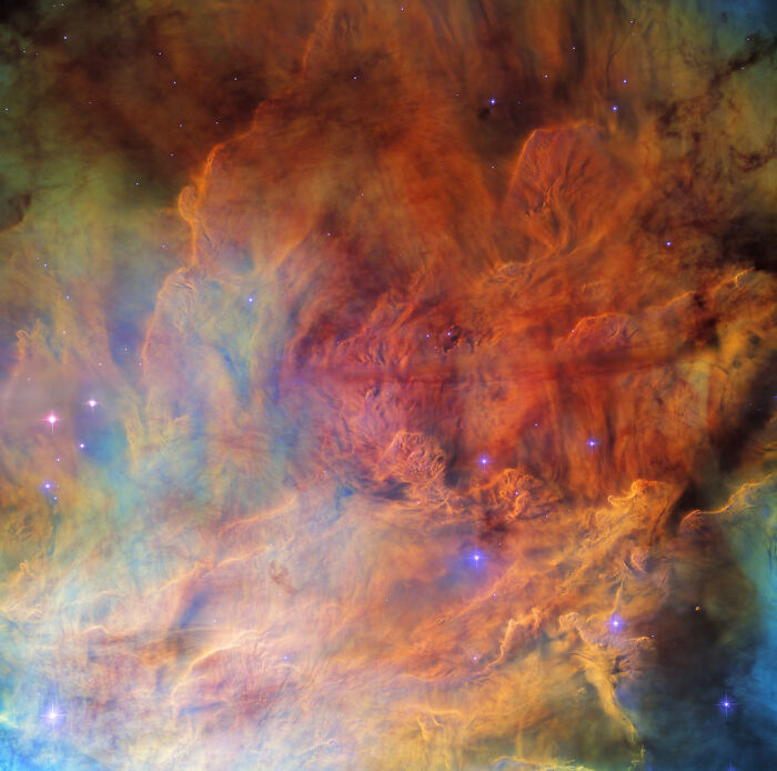 Colorful nebula with vibrant clouds and stars in deep space, showcasing amazing nebula visuals.