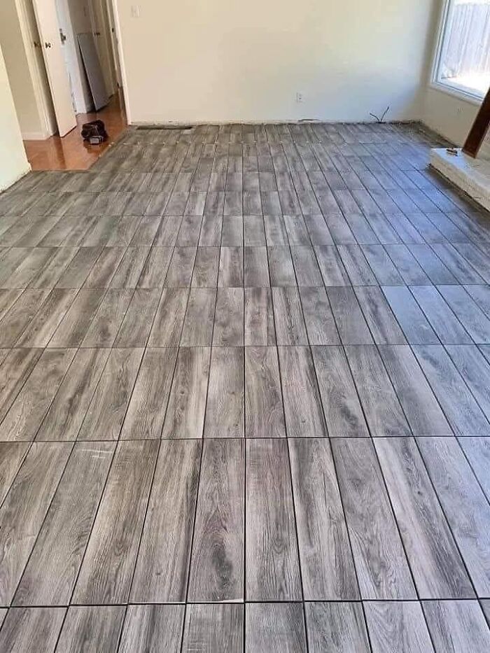 Uneven tile floor alignment showcasing funny cheap construction fails.