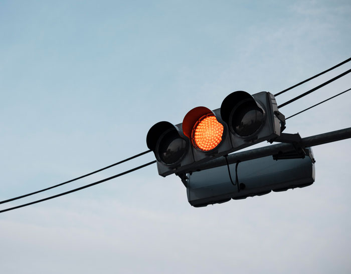 Traffic light showing red signal, emphasizing important security measures often overlooked.