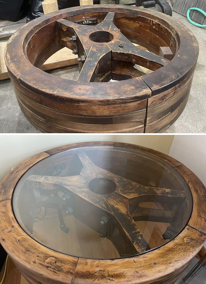 Old things restoration of a wooden wheel transformed into a glass-top table, highlighting craftsmanship and vintage style.