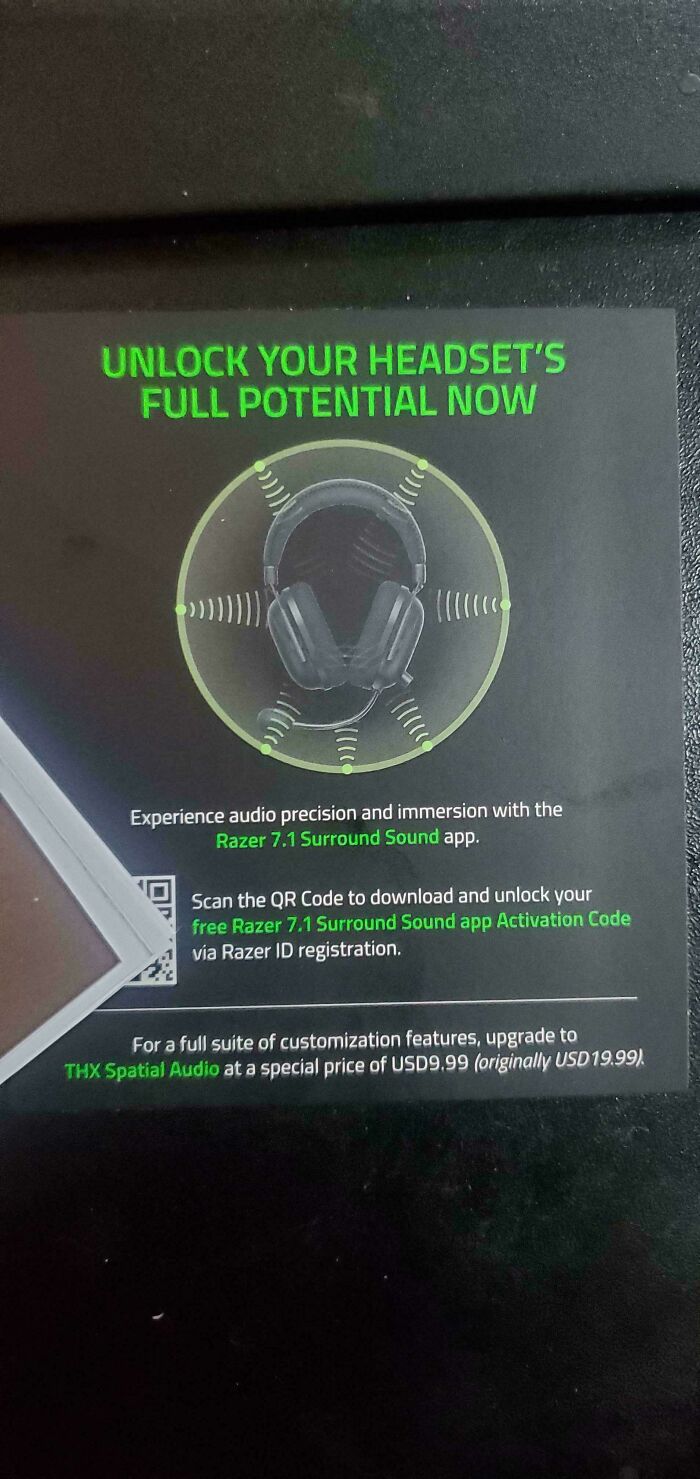 Text promoting Razer 7.1 Surround Sound app with deceptive-marketing-techniques using a QR code for activation.