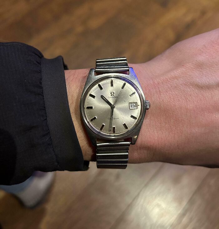 Vintage Omega watch inherited, worn on a wrist with a black sleeve.