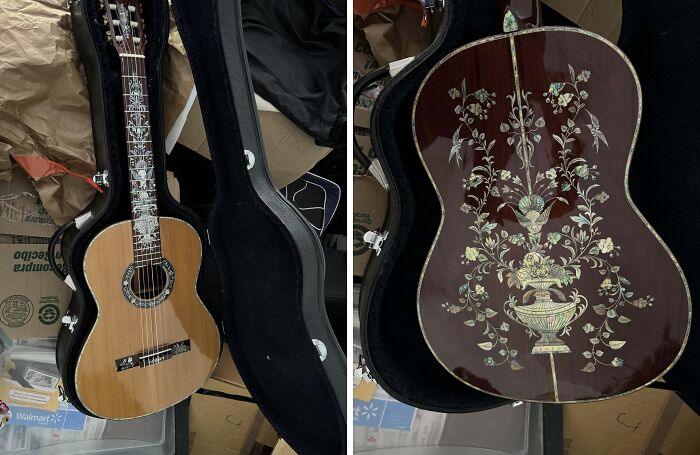 Ornate guitar with floral designs in a case, part of a cool inheritance collection.