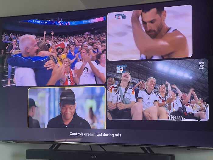 TV screen displaying a sports event with overlay ads, illustrating deceptive-marketing-techniques.