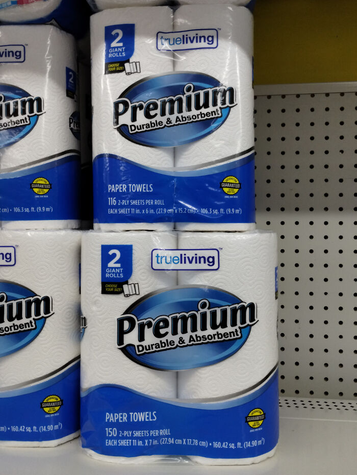 Premium paper towels packaging with "2 giant rolls" claim displayed.