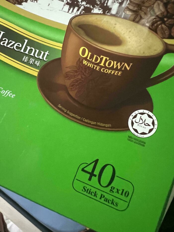 Misleading packaging design showing coffee cup and unclear hazelnut flavor indication on box.