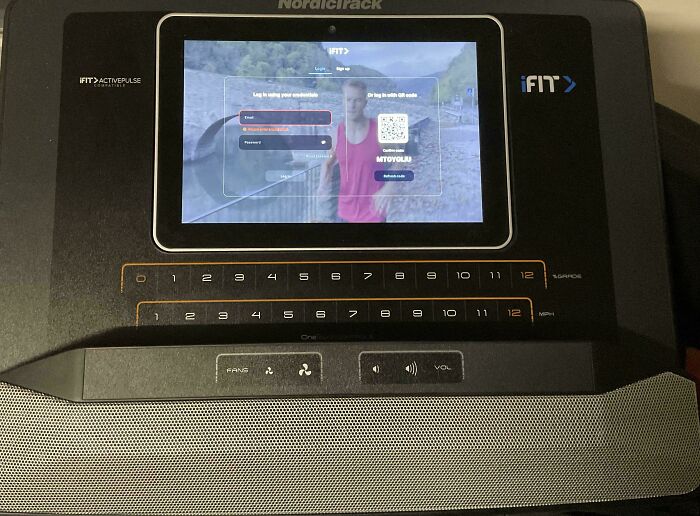 Treadmill screen showing login, illustrating deceptive-marketing-techniques in fitness equipment interfaces.