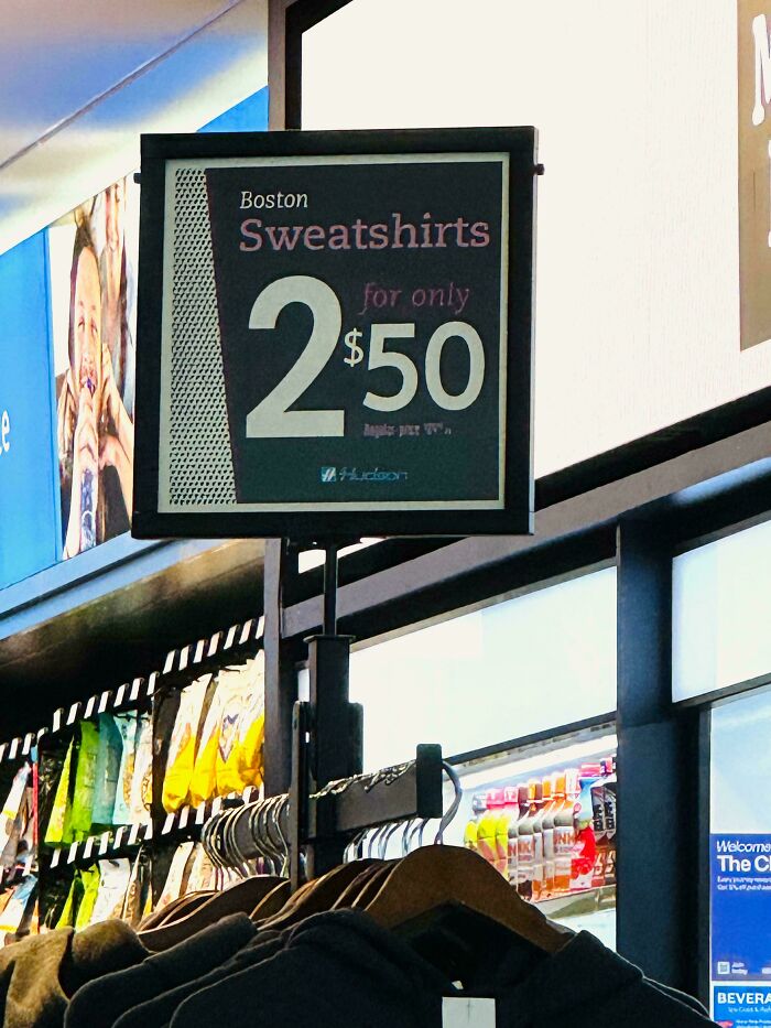 Store display showing a sign for "2 sweatshirts for $50," illustrating deceptive marketing techniques in pricing.