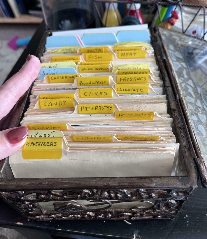 Recipe box filled with organized vintage inheritance cooking cards.