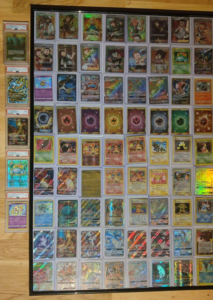 Collection of rare Pokémon cards, a cool inheritance displayed in a framed layout on a wooden surface.