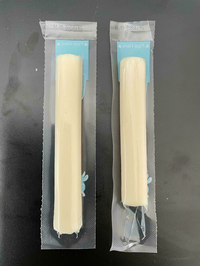 Misleading packaging design with cheese sticks in large wrappers, creating the illusion of more product.