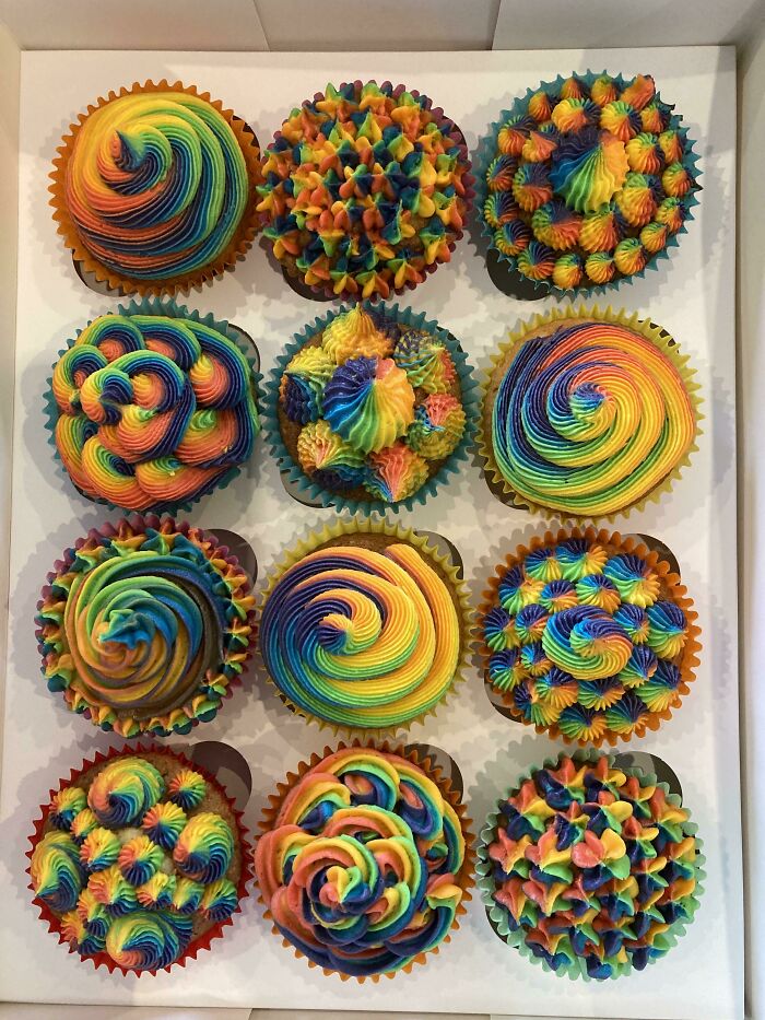 Colorful cupcakes with intricate rainbow frosting designs, perfect for foodies who love beautiful food pics.