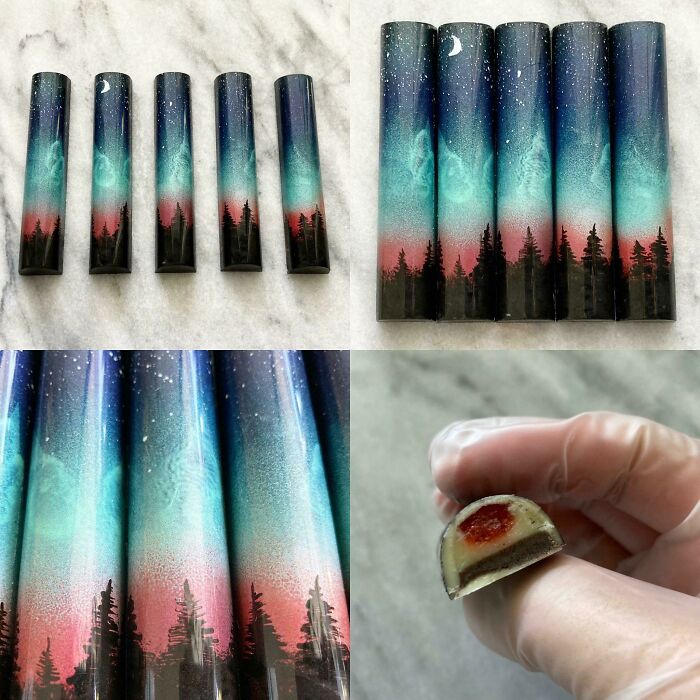 Beautiful food pic of chocolate bars with a painted night sky and forest scene, showing intricate detail and a delicious interior.