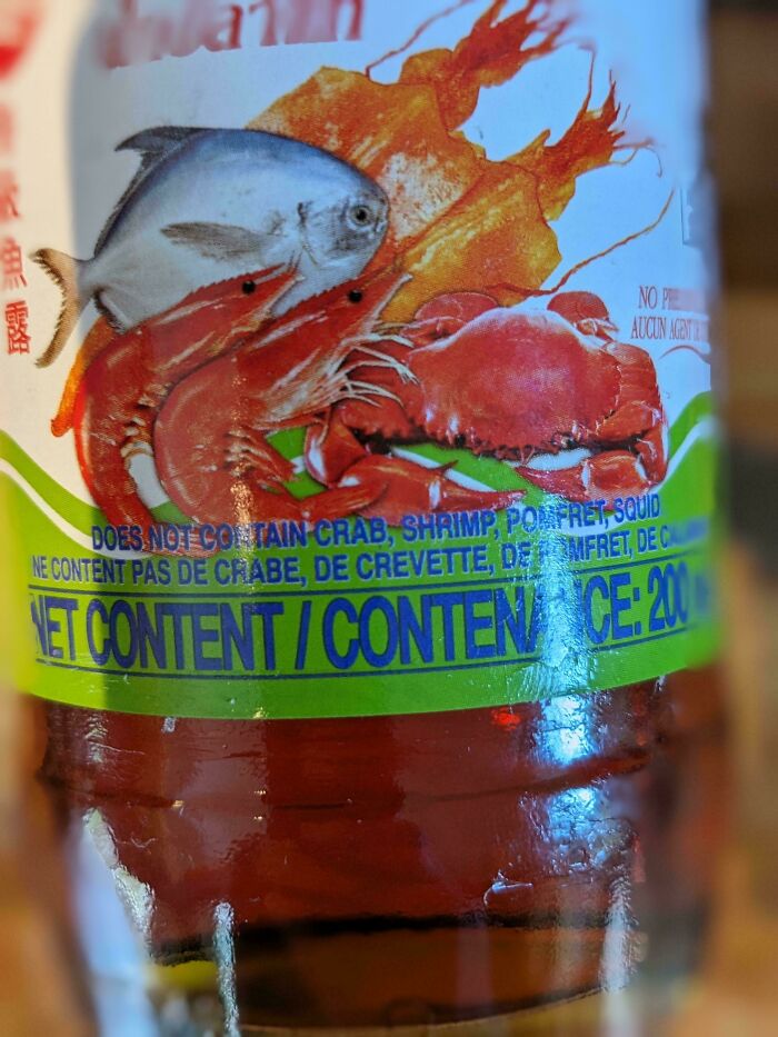 Misleading packaging design with seafood images but label states no crab, shrimp, pomfret, or squid content.