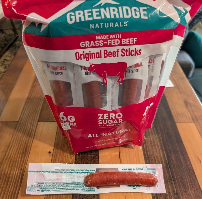 Misleading packaging design showing large beef sticks bag and one small stick in front.