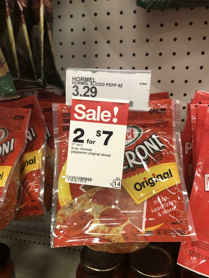 Pepperoni packaging with deceptive marketing techniques showing a confusing sale sign in a supermarket.