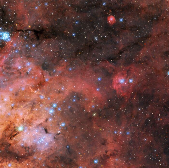 Stunning image of a colorful nebula with bright stars scattered across the cosmic landscape.