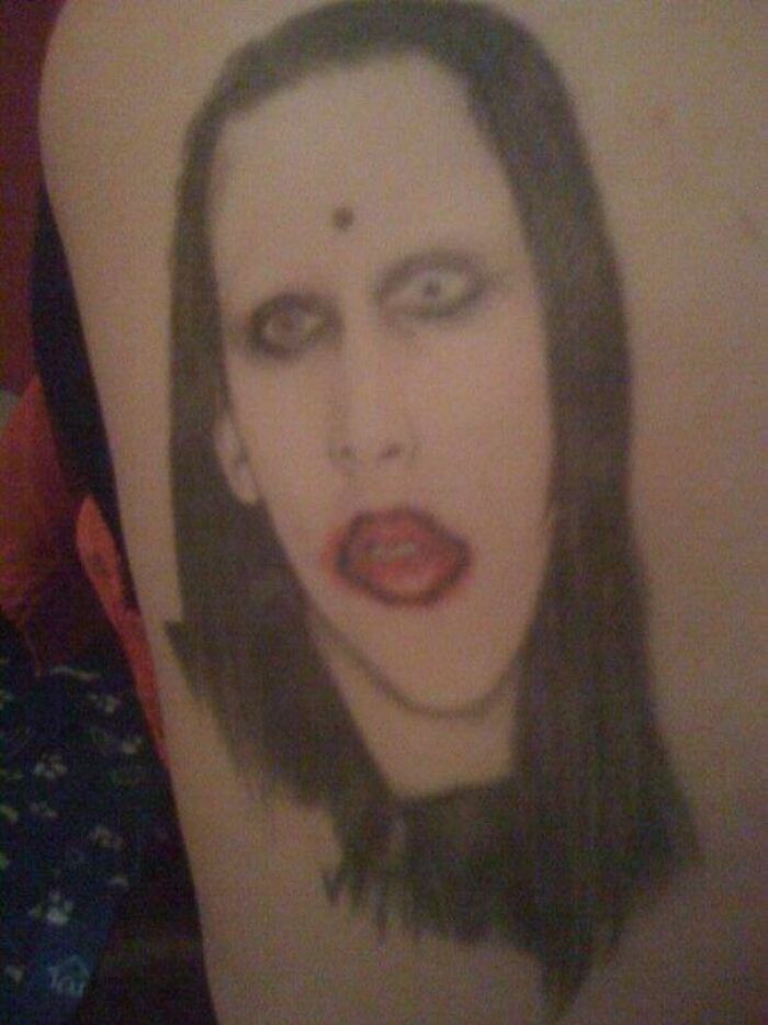 Portrait tattoo with an epic fail design, featuring a distorted face.