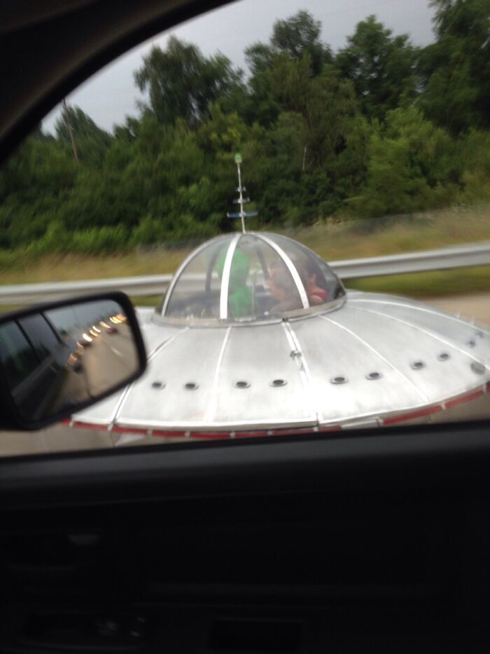 UFO-shaped vehicle on highway, showcasing interesting things on the road.