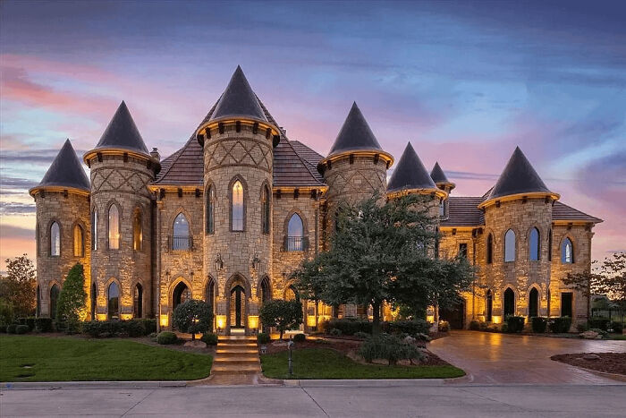 Extravagant mansion with turrets at sunset, illustrating that money can't buy taste.