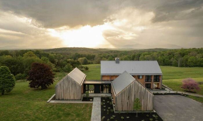 Modern house against scenic sunset, showcasing design that suggests money can't buy taste.