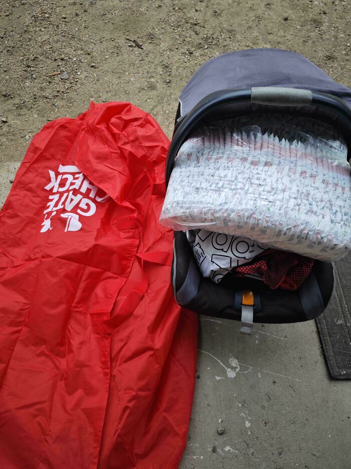 A stroller packed with diapers, showcasing a clever parenting trick for travel and organization.