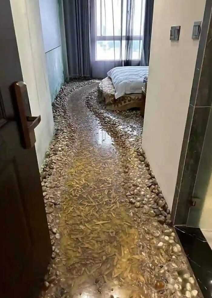 Bedroom with a gravel walkway as flooring, illustrating a funny cheap construction fail.