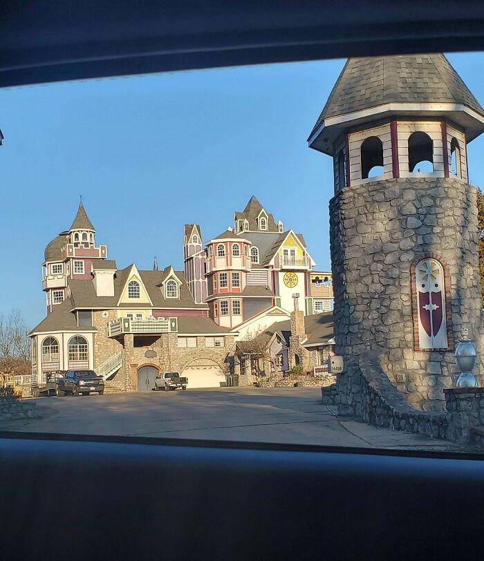 Unusual castle-style house with turrets and varied architecture, illustrating that money can't buy taste.