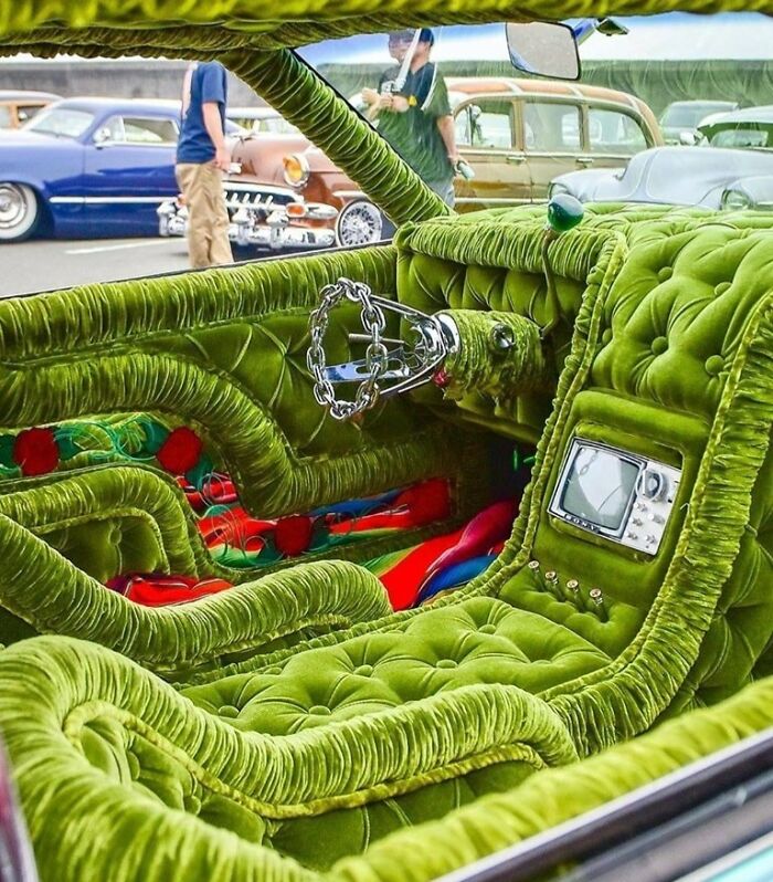 Green velvet interior of a customized car with unusual plush design, depicting a unique car-fail.