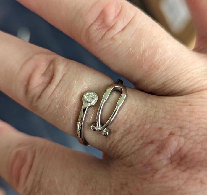 Silver adjustable wrench ring on a woman's hand, showcasing unique gifts for women.