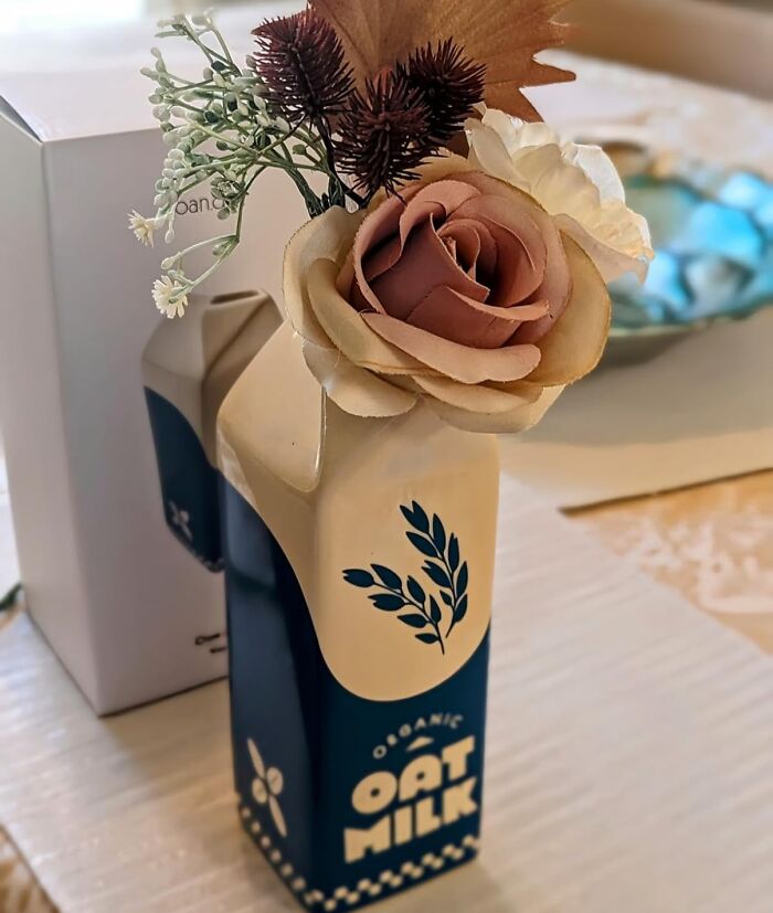 Creative oat milk carton vase with flowers, a unique gift for women for Christmas.