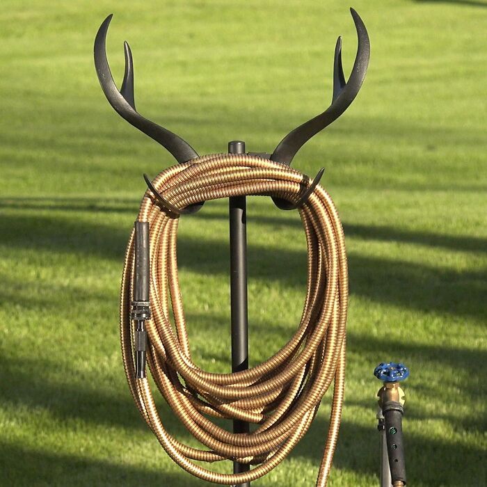 Garden hose wrapped on antler-shaped holder, a unique gift for women for Christmas.