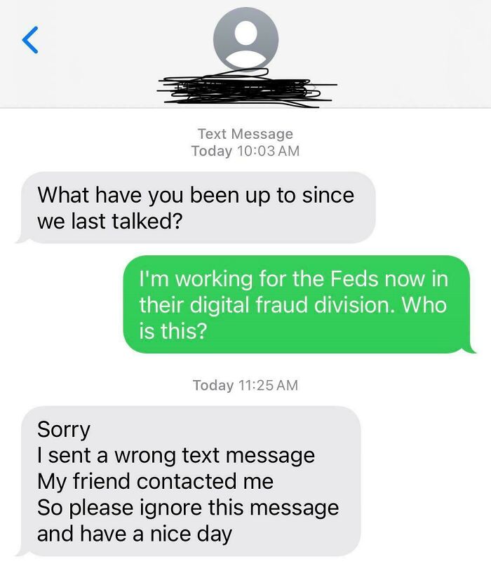 Phone screen showing a response to a scam text, discussing digital fraud division.