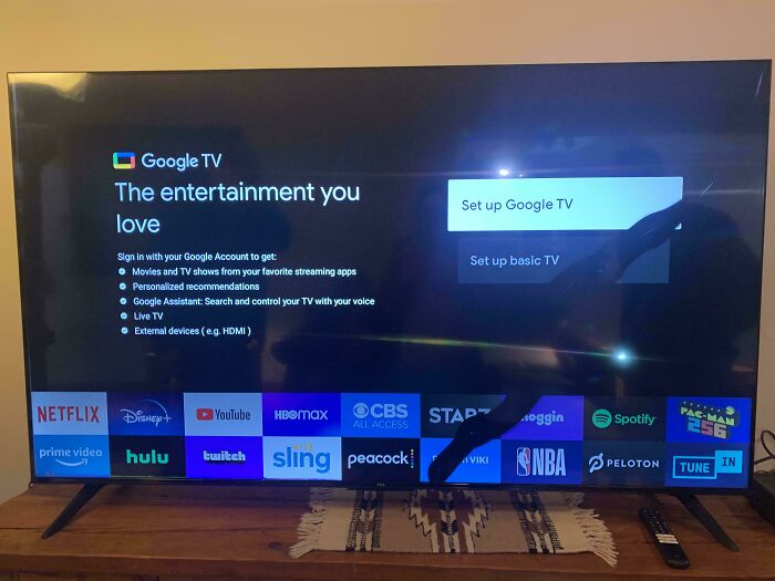 Google TV setup screen with streaming apps visible.