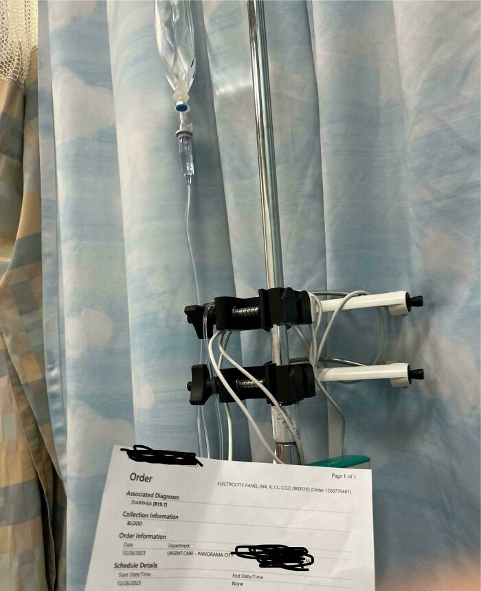 IV pole with medical documents, symbolizing Christmas bad day accidents in a hospital setting.