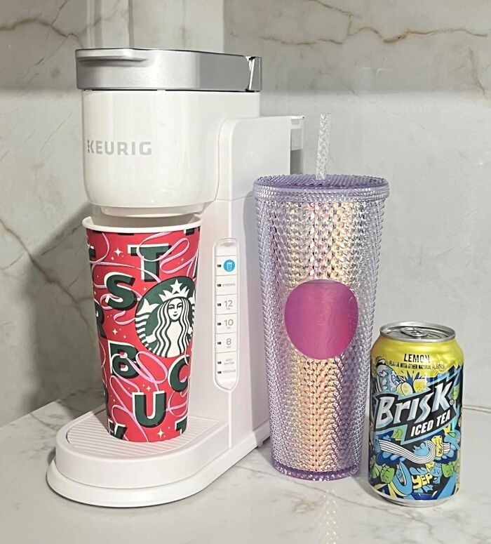 Keurig machine with Starbucks cup, glitter tumbler, and Brisk iced tea can, ideal gifts for teens.