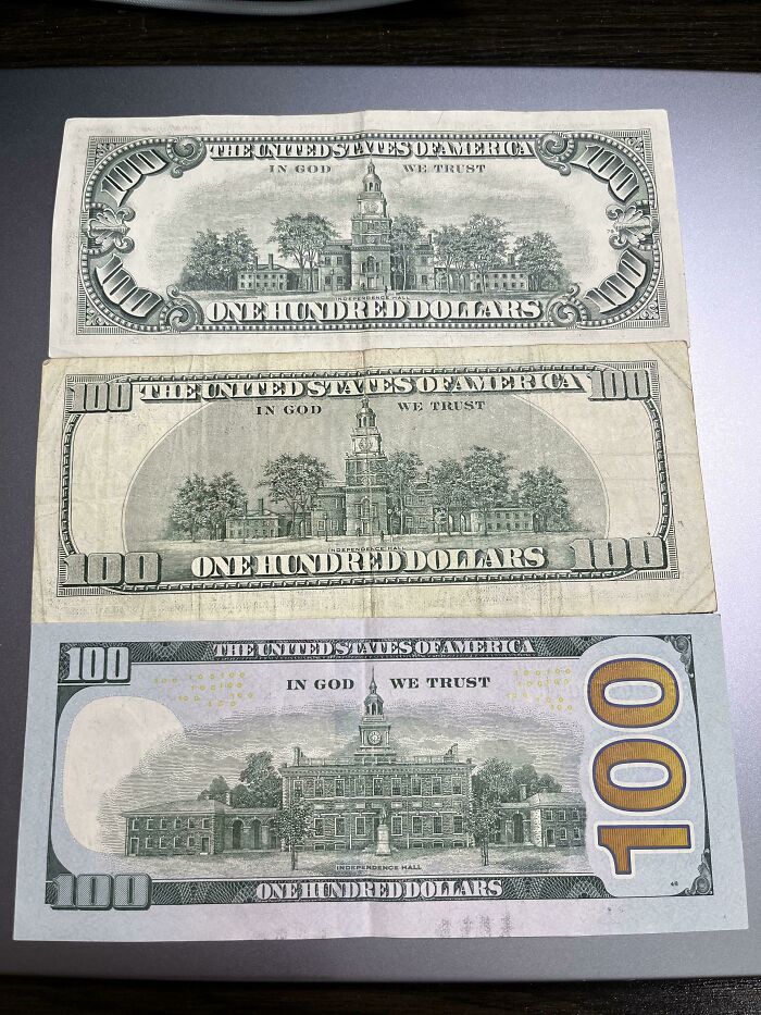 Three different designs of one hundred dollar bills showcasing historical changes in currency.