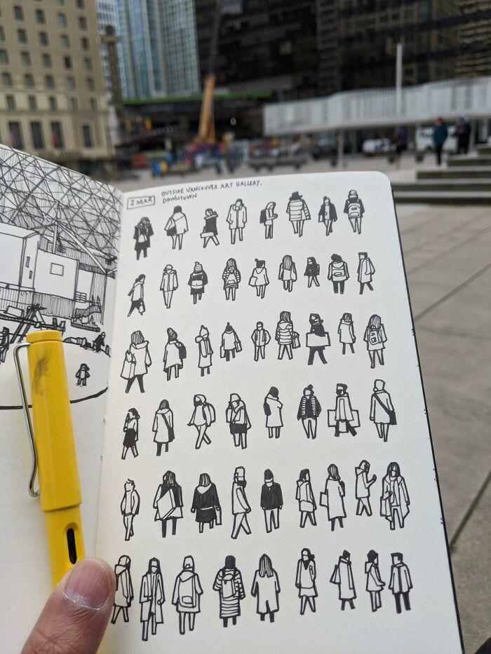 Notebook showing drawn figures in an urban setting, highlighting fascinating pic details with a city backdrop.